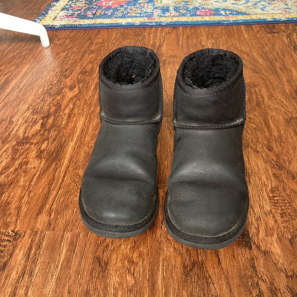 Black leather UGG mini boots